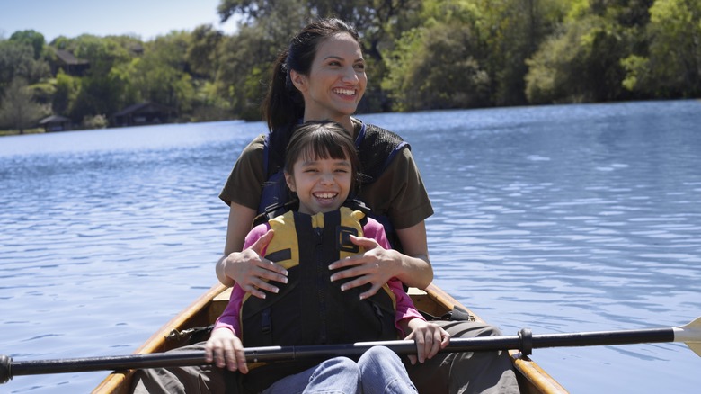 Mother and daughter canoeing