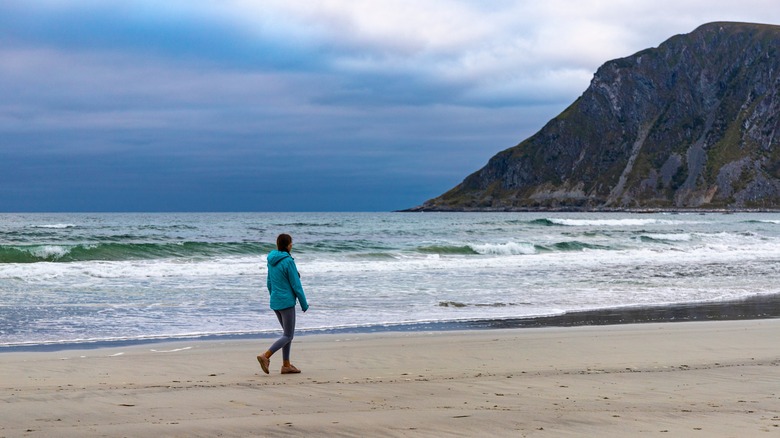Woman walking on Uttakleiv Beach