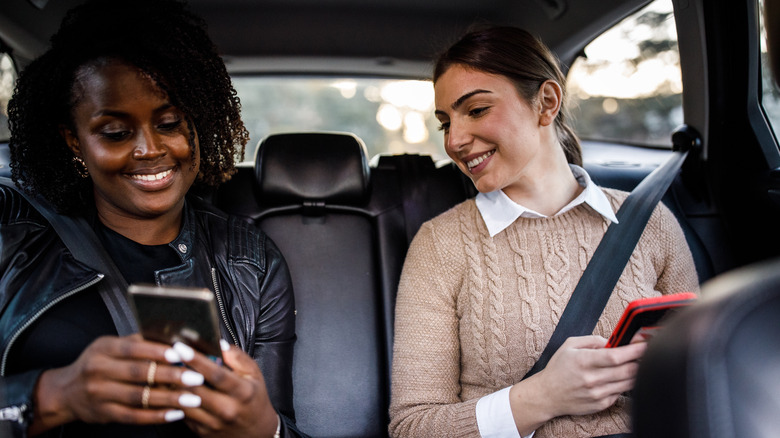 Uber passengers using phones