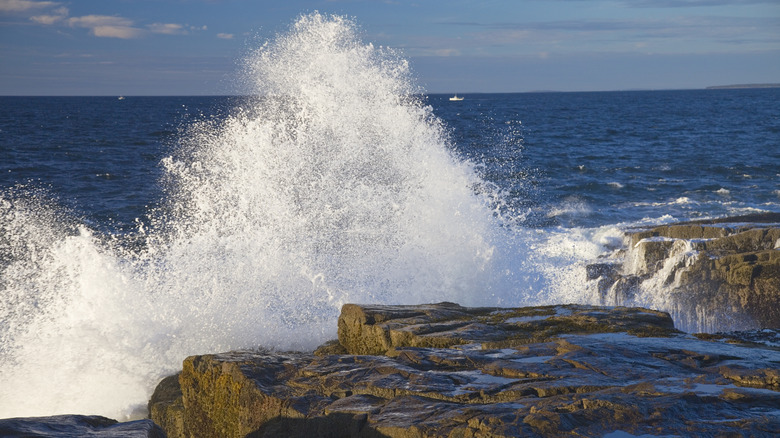 ocean waves hitting rocks