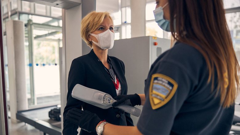 female passenger in airport security