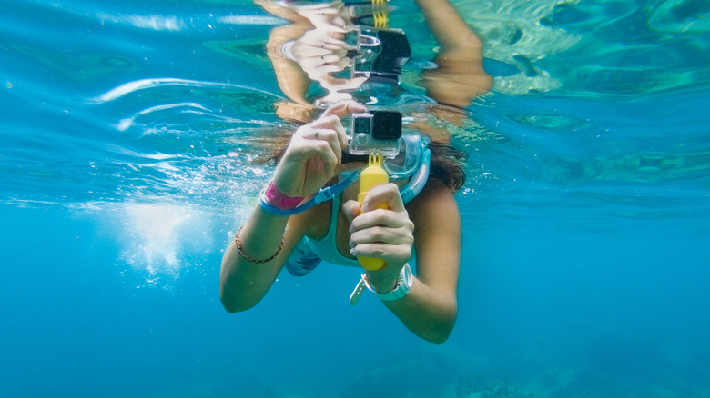 Traveler snorkeling with a Go-Pro