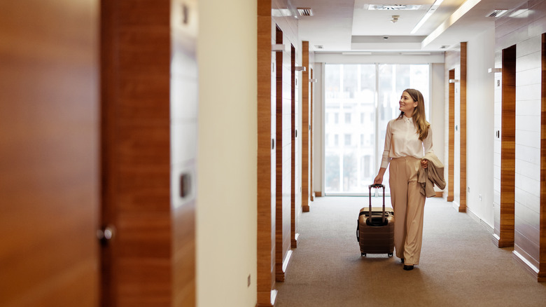 Woman in hotel hallway