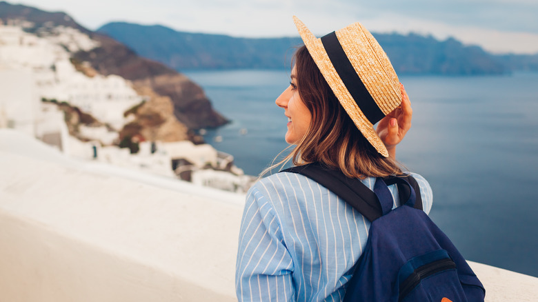 Traveler overlooking the caldera, Santorini