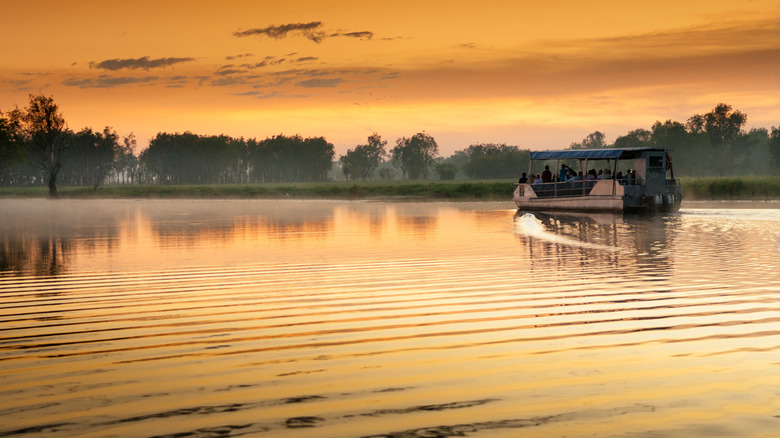 Boat on a billabong at sunset