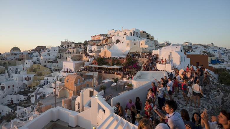 Tourists gathered at sunset, Oia