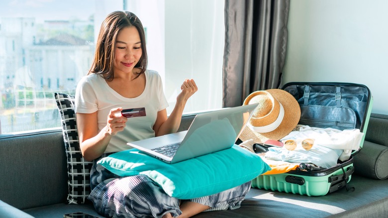 Woman paying for hotel online