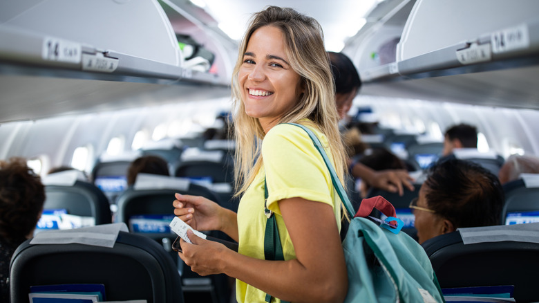 happy woman on plane