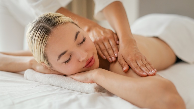 Woman getting a shoulder massage