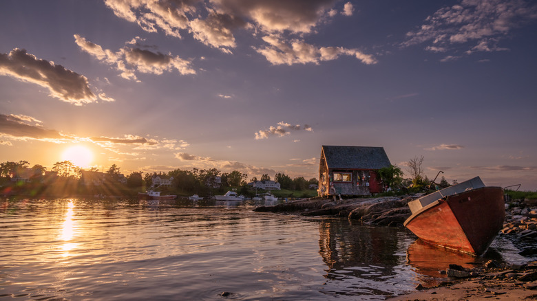 Fishing shack and boat at sunset in Harpswell