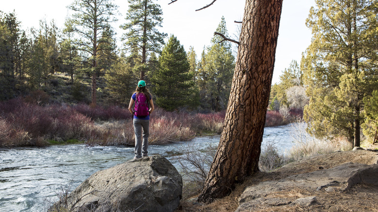 Woman hiking by river near Bend