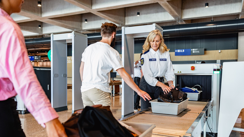 travelers in airport security