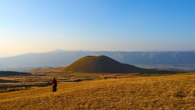 Woman approaching Mount Aso