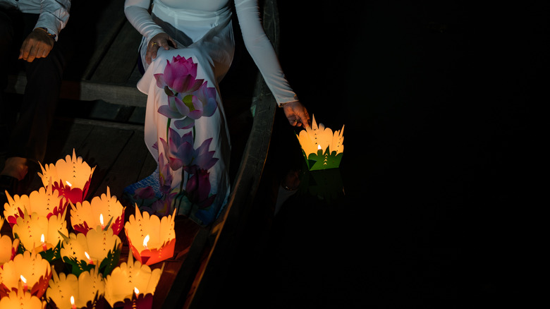 placing floating lantern in water