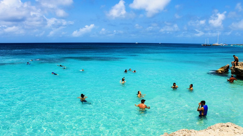 Travelers swimming in Tres Trapi