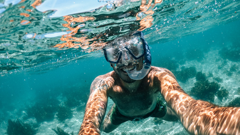 Snorkeler smiling underwater