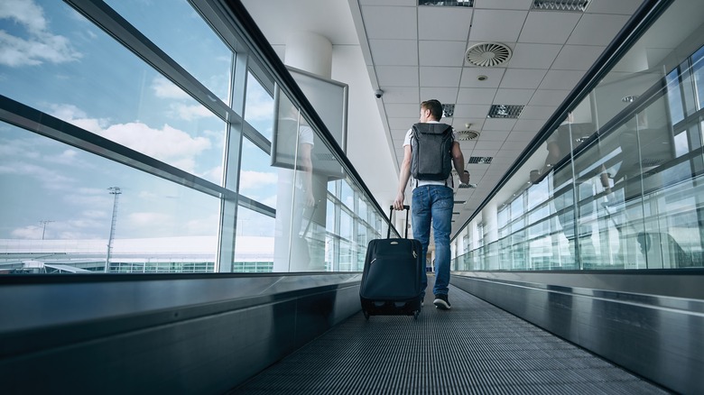 man walking in airport