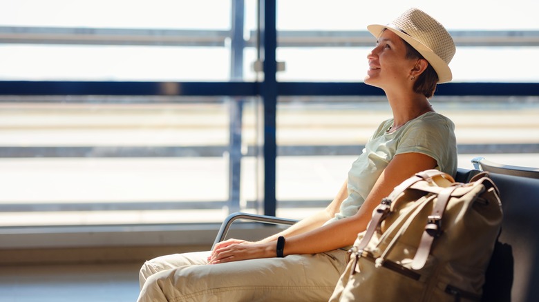 Happy woman at airport