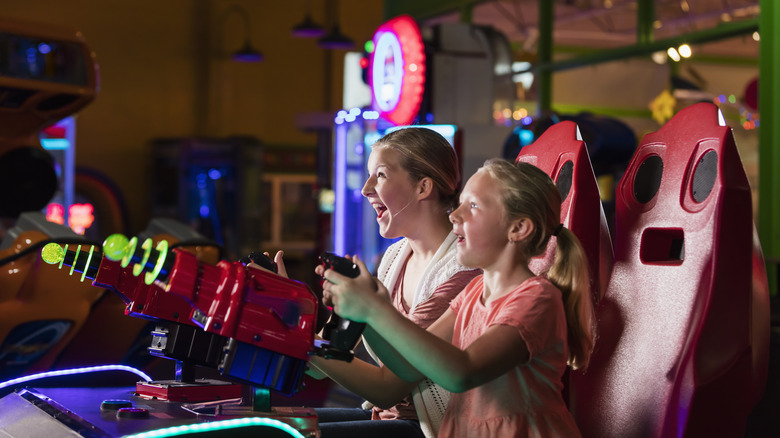 Family playing arcade games