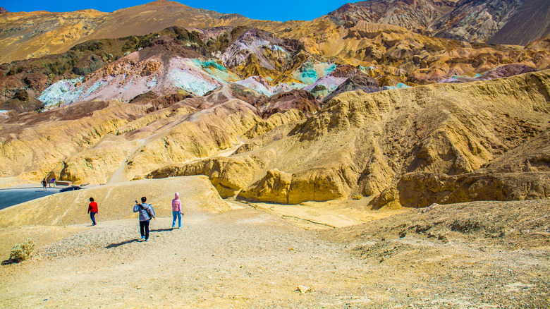 hikers at Artists Palette in Death Valley
