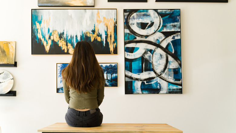 Woman looking at art