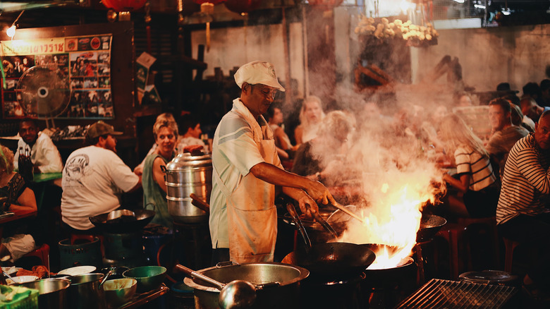 Street food chef in busy market