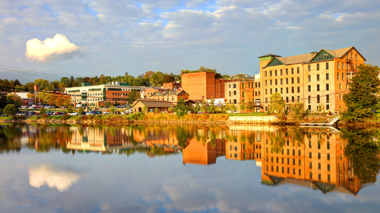 Old buildings reflected in water