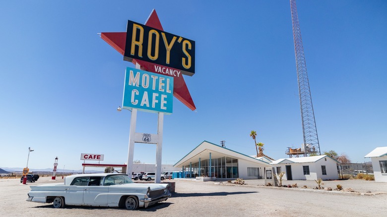 Roy's Motel Cafe sign car