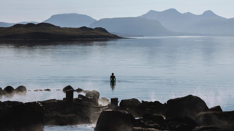 Person in hot springs ocean