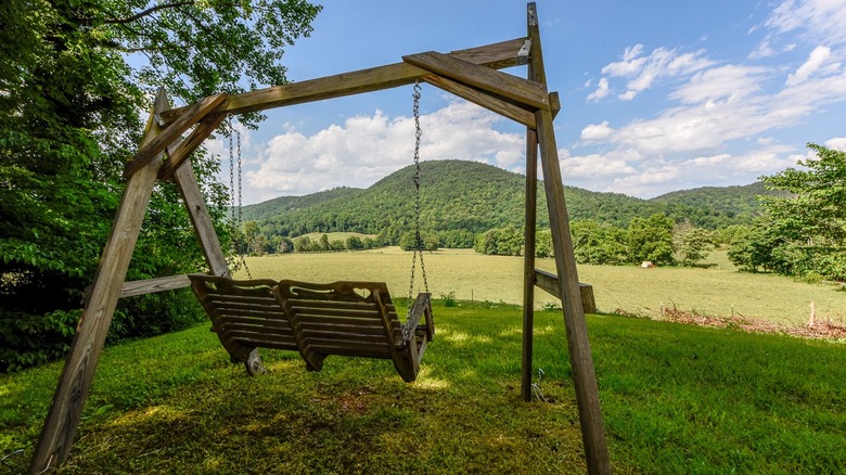 swing bench with mountains in distance