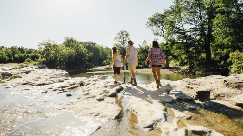 Girls walking on the river banks