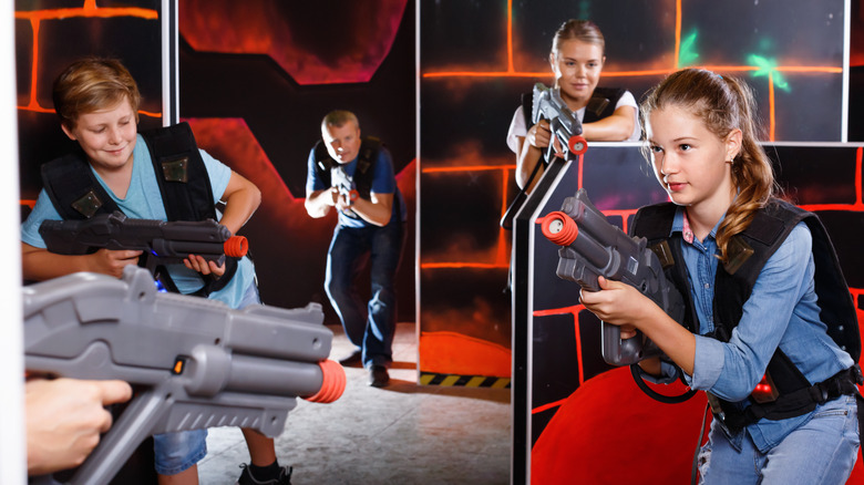 Family playing laser tag