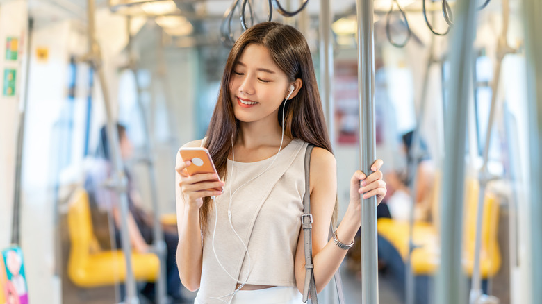 Asian woman on train