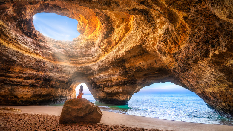 Woman in sea cave