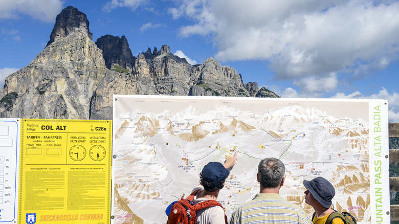 Hikers look at trail map