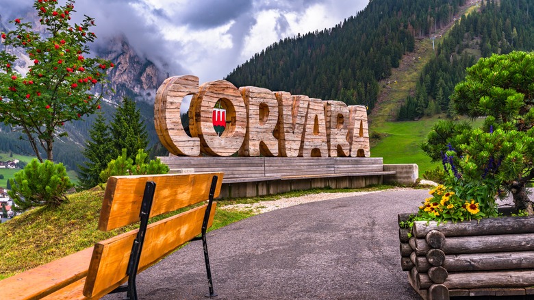 Corvara sign with view of mountains