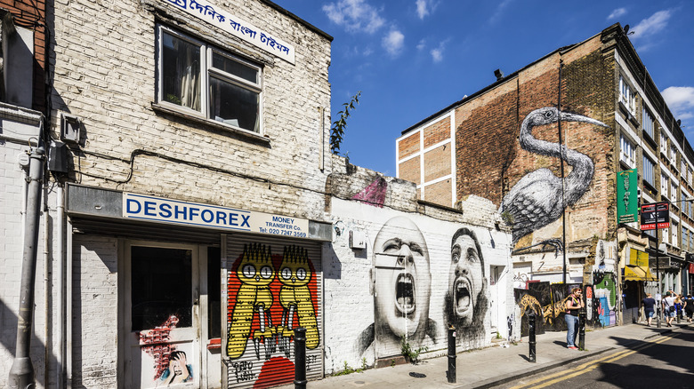 Street with graffiti on brick buildings