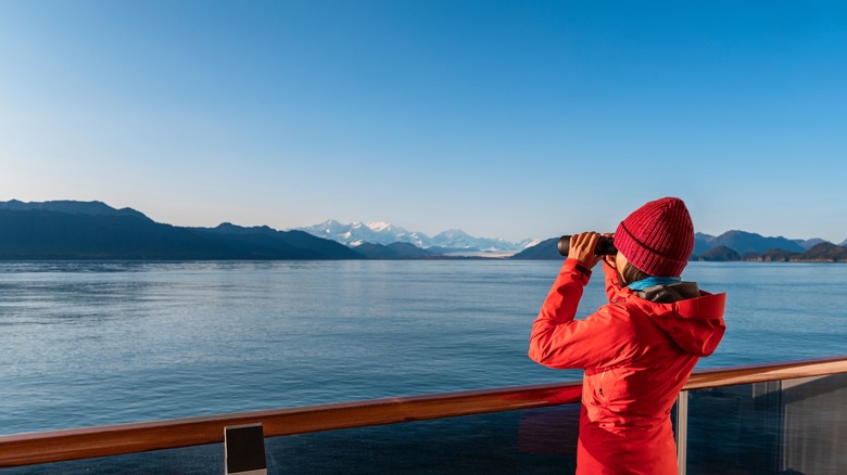 Woman on boat with binoculars