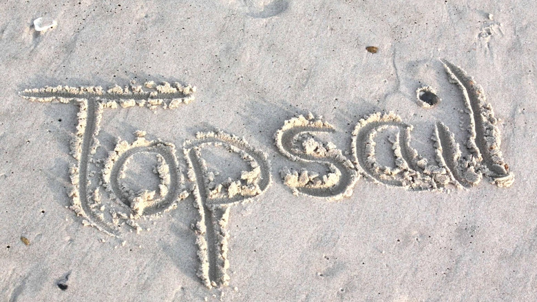 Topsail written in sand on the beach