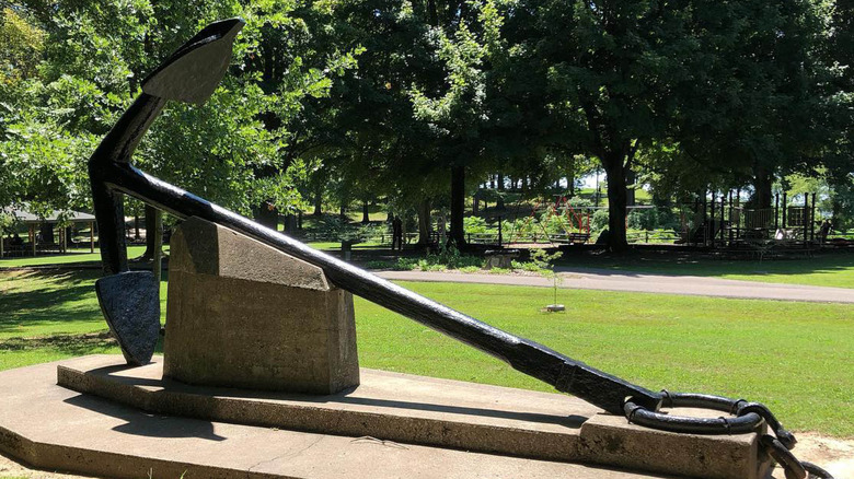 Large historic anchor in park