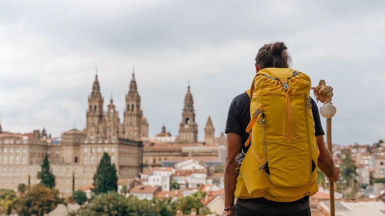 Backpacker overlooking Santiago de Compostela