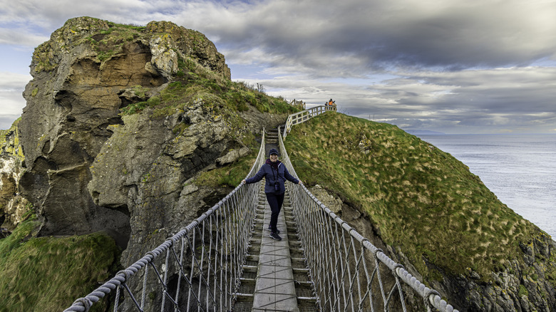 A woman on the Carrick-a-Rede rope bridge