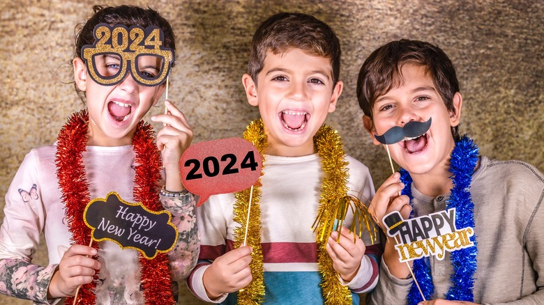 Kids with New Year's Eve photo props