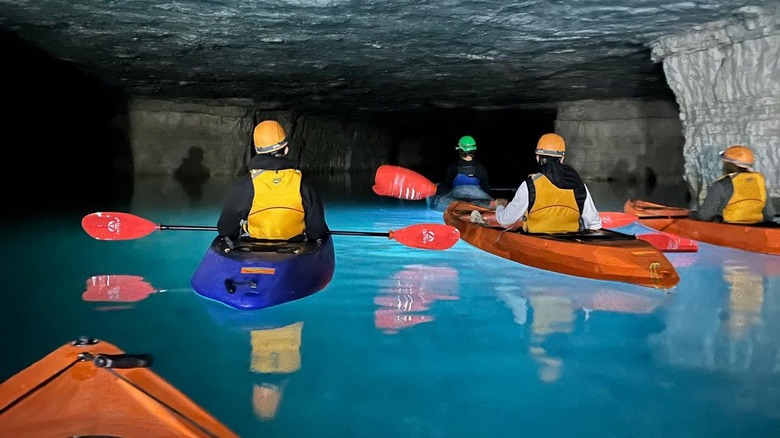 People cave kayaking