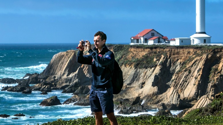 Man photographing beach