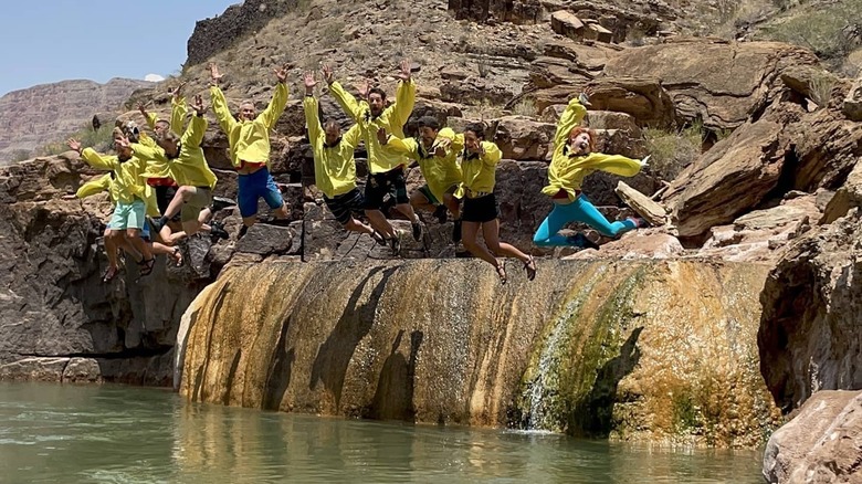Rafters cliff jumping in canyon