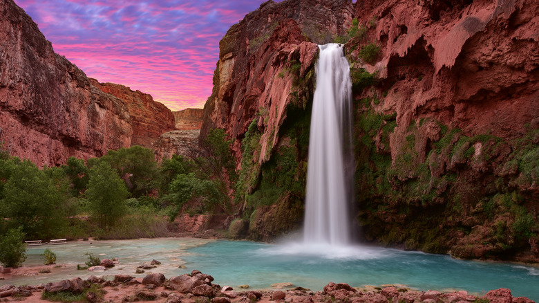 Waterfall flowing into turquoise pool