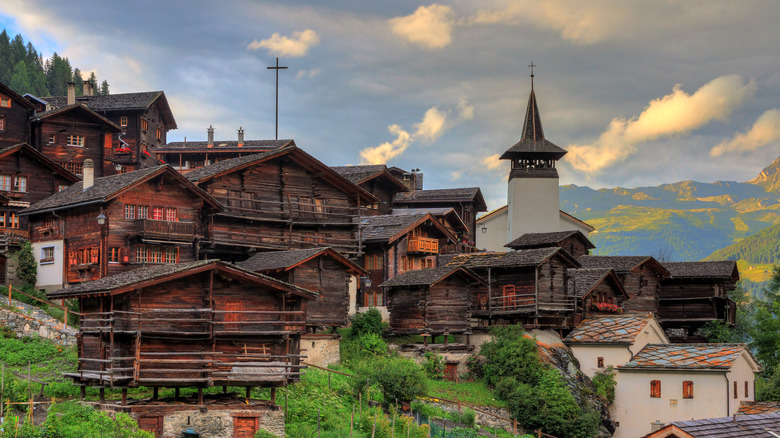 chalets and church in mountains