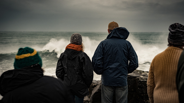 people storm watching on the pacific