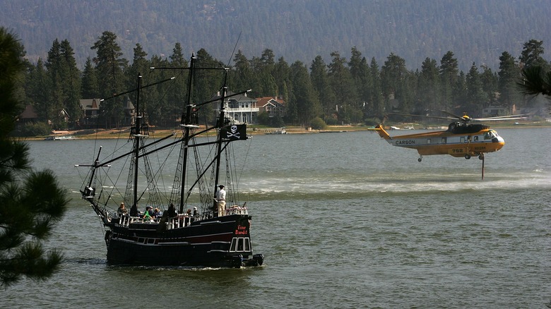 A pirate ship and helicopter over Big Bear Lake